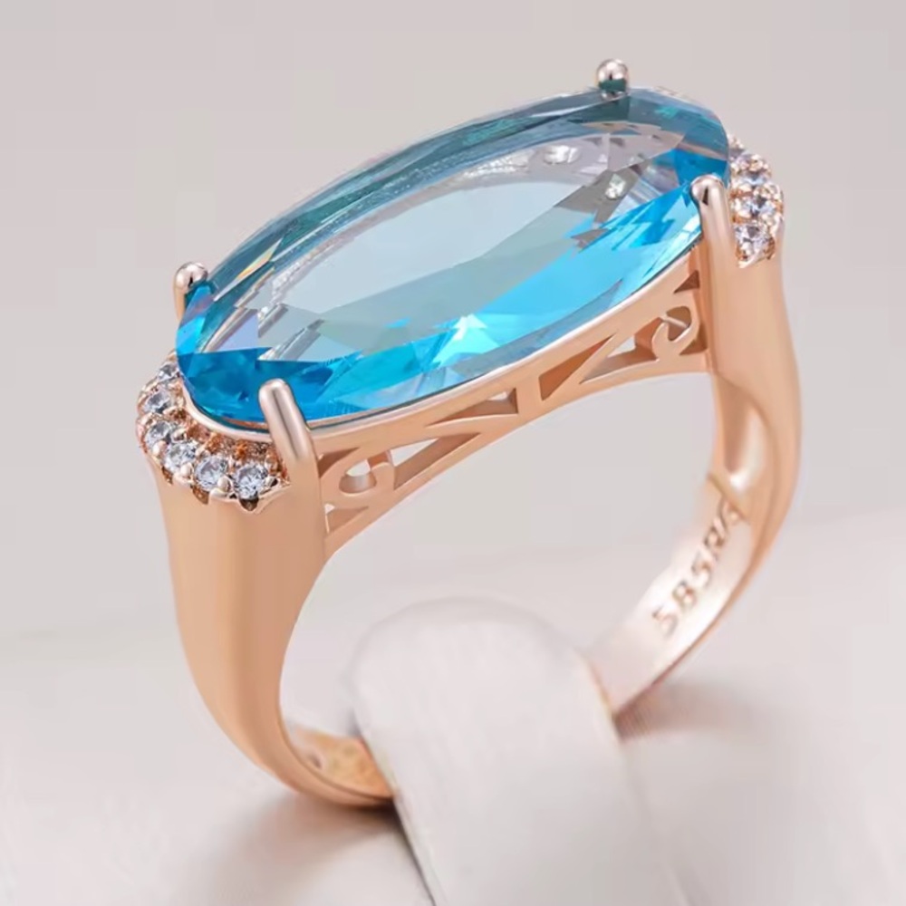 Rose Gold Ring with Aquamarine Blue Oval Gemstone